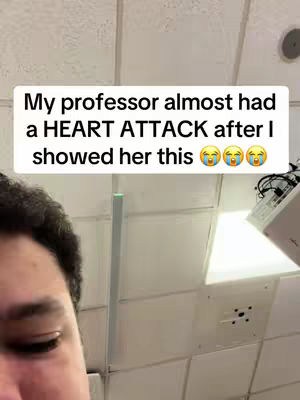 A close-up shot features the lower half of a person's face, looking towards the left, with the top of their dark hair visible. A text overlay in a white box at the top of the image reads, 'My professor almost had a HEART ATTACK after I showed her this,' followed by three crying laughing emojis.