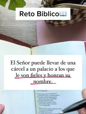 The image features an open bible with a highlighted passage and a text overlay at the top. A black pen and a purse are visible. The bible has yellowed pages and lines, and the text is in black. The overlay is white and contains the title 'Reto Biblico', Spanish for 'Bible Challenge'.