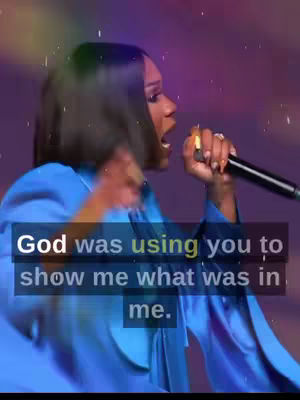 A woman with short, dark hair is seen from the side, mid-performance. She is holding a microphone and singing with her mouth open. Text overlays appear, highlighting a quote from the speaker.