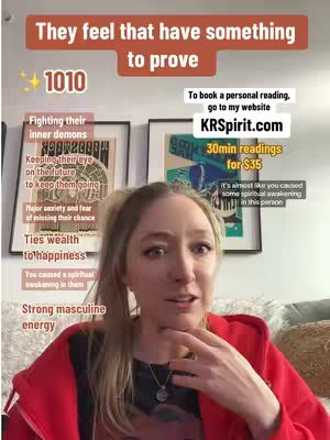 A woman with blonde hair and a red jacket stands in front of two framed pictures on a wall. She is looking towards the viewer and touching her neck and chin. Text overlays are positioned around her and on the image, including a website address, pricing, and a title that states, “They feel that have something to prove”.