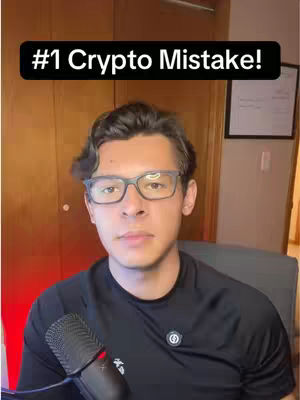 A man in glasses and a black shirt looks directly at the camera. A microphone faces him. The text overlay says: #1 Crypto Mistake!
