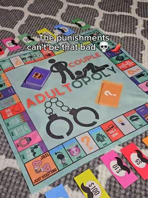 The image showcases a board game called 'ADULTOPOLY' with various game pieces and cards scattered on it. The board itself sits on a patterned surface. Text overlays include 'The punishments can't be that bad.' The overall composition suggests a couple playing the game.