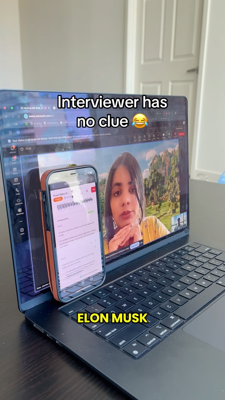 A laptop displays a video call with a woman, overlaid by a smartphone screen. Text overlays read 'Interviewer has no clue' and 'ELON MUSK'. The scene is set in a bright room.