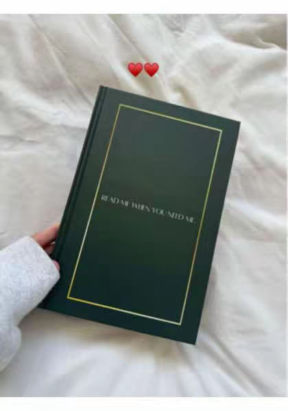 The cover image shows a hand holding a dark green book at an angle. The book has a gold border and the text 'READ ME WHEN YOU NEED ME' is written on the front.