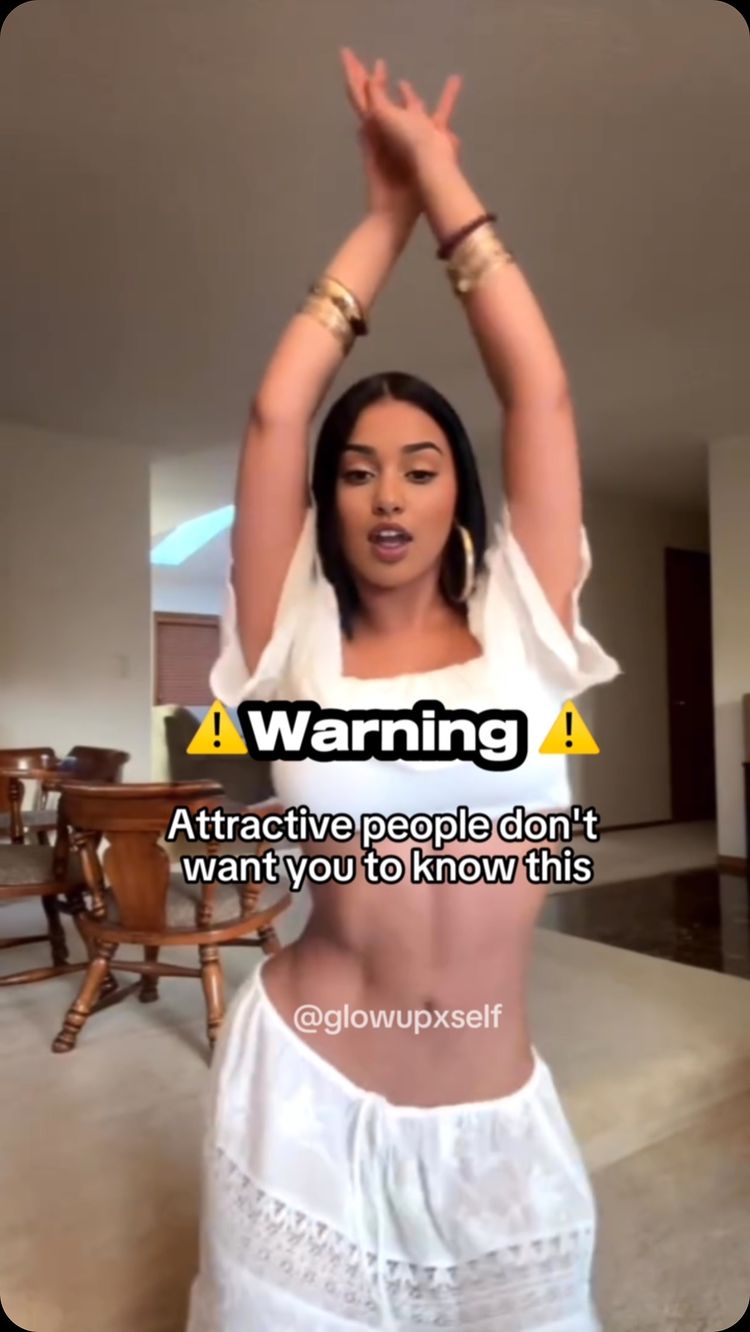 The cover image shows a woman with dark hair and a white outfit, arms raised above her head. She is standing in what appears to be a living room. Text overlay includes a warning sign, then the text 'Attractive people don't want you to know this' and the creator's username.