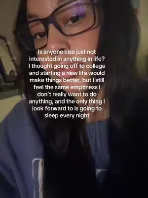 A close-up shot features a person of color with glasses, looking towards the camera. The image is slightly blurred, and text overlays the individual.