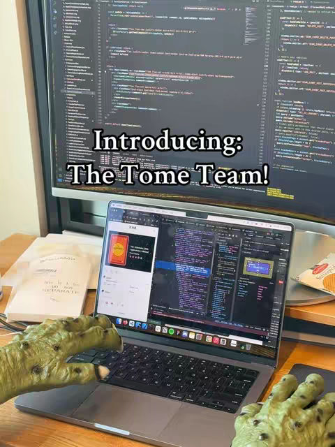 A close-up shot features a person's hands (green skin) interacting with a laptop, revealing code, set against a backdrop of a computer monitor displaying more code. Text overlays introduce "The Tome Team!"