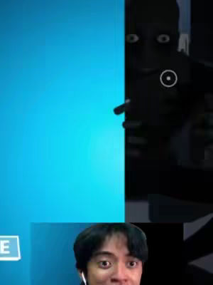 The cover image is split into two main sections. On the right is a dark area with features suggesting an eerie entity, possibly a game character, peeking through a doorway. A white circular highlight suggests the object. The left side displays a bright, uniform blue background. At the bottom, superimposed, is the creator's face, showcasing open, wide eyes conveying fear or shock, set against a dark background. The overall composition suggests a video of a horror game or jump scare reaction.