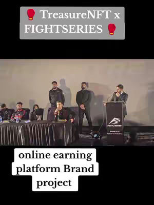 The cover image shows a well-lit presentation setup. In the background is a screen, with several people standing behind it. In the foreground, a row of people sit at a long table, with one person speaking into a microphone at a podium with a company logo.