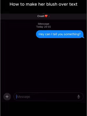 The cover image shows a mockup of a dark-themed iPhone iMessage conversation. The background is completely black. At the top, the text 'How to make her blush over text' is written in white. Below that, there is the word 'Crush' and a heart emoji, alongside the sender information, time, and bubble with the text: 'Hey can I tell you something?' displayed in the conversation. The bottom of the screen includes a message input field.