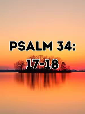 The image captures a serene landscape at sunset. The foreground reflects a tranquil body of water mirroring the sky's gradient colors of yellow, orange, and red. A small island with silhouetted trees sits in the middle of the water. The text "PSALM 34: 17-18" is overlaid at the center, in a bold, white font with a black border.