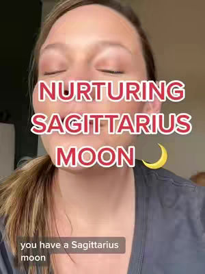 The cover image is a selfie-style shot with a woman in the foreground, mid-shot. Her eyes are closed, and she has a soft, natural makeup look. The background is somewhat blurred, suggesting an indoor setting. Overlaid on the image are large, red text elements that read "NURTURING SAGITTARIUS MOON" with a crescent moon graphic, on the right side of the the screen, just beneath the main text.