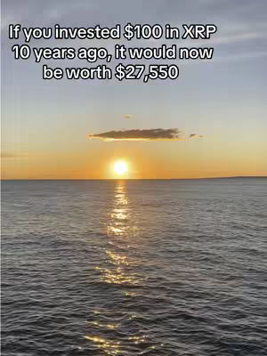 A serene image capturing a sunset over the ocean. The sky transitions from orange to a dark blue, reflecting on the water's surface, which mirrors the sky's colors. The sun, a bright orb, sits on the horizon, and a faint cloud is present in the sky. The overall composition is balanced, with the sky and water occupying roughly equal visual weight, creating a sense of calm.