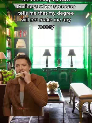 A man in a brown jacket is seated in a room with green walls and bookshelves, eating a sandwich. Text overlays on the image comment on a degree's value.