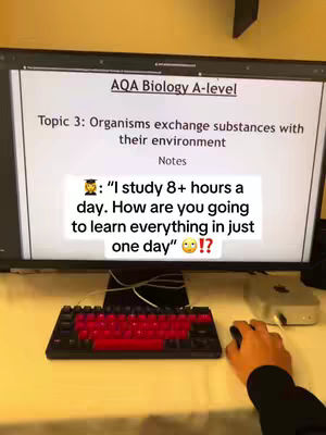 A computer monitor displays a Biology A-level topic, with a black keyboard and mouse in the foreground. Overlay text prompts a question about studying.