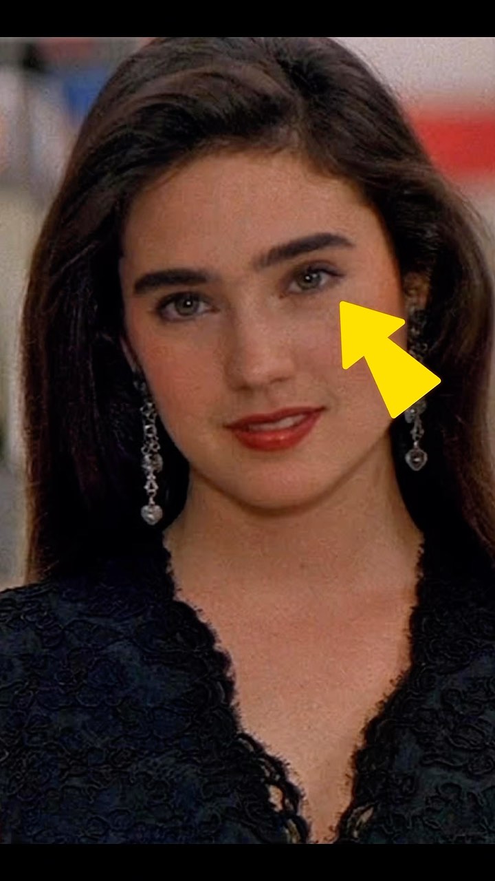 The cover image is a close-up portrait of Jennifer Connelly with an arrow pointing over her face. She has dark brown hair, fair skin, and is wearing a black lace top and simple earrings. The lighting is soft, and she has a slight smile.