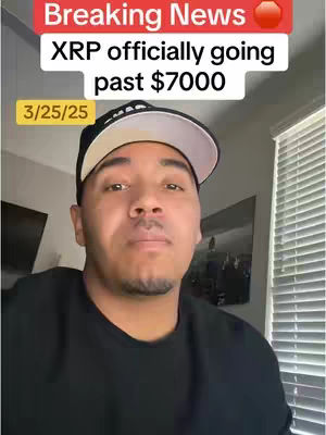 The cover image portrays a man addressing the camera, set against a background of a home interior. Above the man's head, text overlays convey 'Breaking News' and 'XRP officially going past $7000,' along with a date stamp '3/25/25'. The man is the central focus, appearing to be delivering this news. Other elements of the scene include a portion of a window with sunlight, and a partial view of a television.