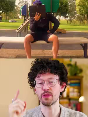 The cover image is a split shot. The top half shows a man sitting on a bench in a park, holding a laptop in front of his face. He's wearing a dark hoodie and shorts, and has a purple beanie on. The bottom half shows a man with glasses, with his index finger up, as if giving advice.