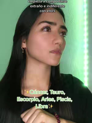 The cover image features a woman in a close-up shot, with text overlays. The woman is looking slightly off-camera with a thoughtful expression. The background appears to be a gradient of green and the woman is wearing a black shirt and has long black hair.
