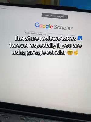 A laptop screen displaying the Google Scholar webpage. Hooked text sits over the screen, and the overall composition is focused on the screen with a dim setting.