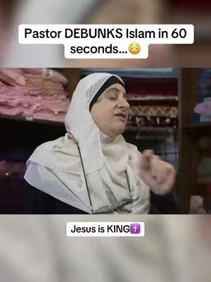 The image is a vertical video frame featuring a woman, seen from the chest up. She is wearing a white headscarf that frames her face against a dark backdrop. There is text overlay saying "Pastor DEBUNKS Islam in 60 seconds..." in white letters above the woman's head. The woman has a dark suit on and is gesturing with her right hand, with a thoughtful expression. At the bottom, a white bar has the words "Jesus is KING" in white text, along with a purple cross. All of the woman and the main text area are well lit. The background shows some bookshelves and room elements.