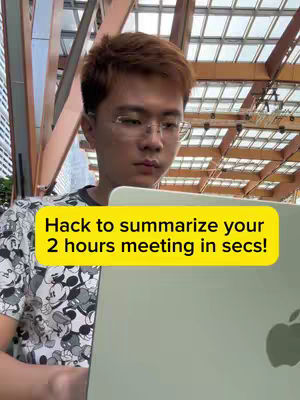 A young man wearing glasses and a patterned shirt is looking down at a laptop. Text overlayed on a yellow background reads, 'Hack to summarize your 2 hours meeting in secs!' Partially visible is a metal and glass structure background.