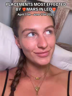 A woman lies in bed, propped up on pillows, looking upwards and slightly to her right with a subtle smile. She has a light complexion, long brown hair pulled back in a braid. She wears a black tank top and a layered gold necklace. Text overlays the image, providing context.