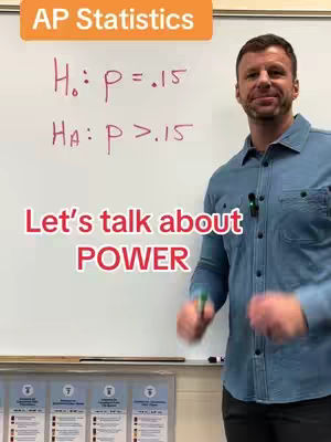 A man stands in front of a whiteboard with statistics equations written on it. The words 'Let's talk about POWER' are in a large, red font overlaid on the image. The man is wearing a blue jean shirt and smiles at the camera.