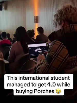The image shows a room with a few people in the seats. The main point of interest is a laptop screen displaying information, and a text box at the bottom that shares an interesting fact.