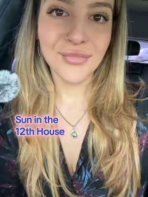 A medium shot features a woman inside a car, likely taking a selfie. She's fair-skinned with blonde hair and wears a necklace. The text overlay, "Sun in the 12th House", is positioned on the lower left. The background suggests an interior space, possibly the inside of a vehicle.