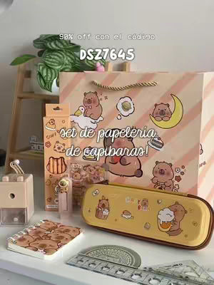 The image features a collection of stationery items. At the center stands a shopping bag, adorned with illustrations of capybaras. The set includes a pencil case, notepad, and other items, and a plant decorates the background, all displayed on a white surface. The overall composition is bright and colorful, featuring pastel tones. In the top left corner, there's an added text overlay.