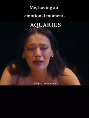 A woman is crying in the image, against a dark background. Text on top says it is an emotional moment. The word AQUARIUS is written under that. At the end of the image, the the name @Aquarius momma is displayed.