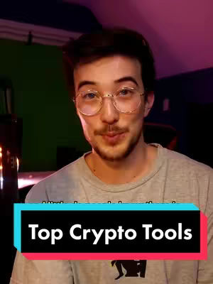 A man with glasses smiles at the camera with a teal and pink text overlay on his torso.