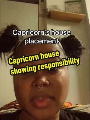 A close-up shot features a person with dark skin, wearing a black top and two small buns on either side of their head. They have a nose ring, and the background is a blurry indoor setting. The image features text overlayed with astrological concepts.