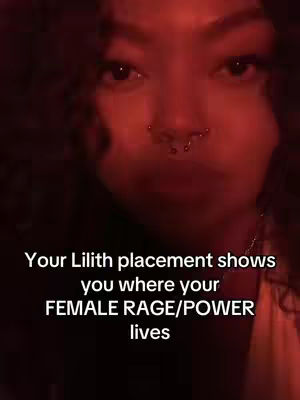 A close-up shot with heavy shadows. The focus is on a person's face with a prominent nose ring. Text overlayed reads "Your Lilith placement shows you where your FEMALE RAGE/POWER lives."