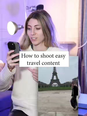 A light-skinned woman wearing a white sweater holds a black smartphone in her left hand, looking toward it with a slight smile. Behind her, a soft purple light is cast by a nearby lamp. To her right, a smaller image is displayed, featuring a person in front of the Eiffel Tower. A text overlay reads "How to shoot easy travel content".