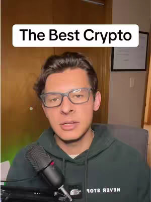 A man with glasses and a dark green hoodie with white text over a wood background and interior.