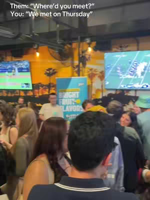 The cover image shows a crowded bar scene, likely during an event. People are gathered, appearing to mingle and socialize. The background includes televisions and a sign, suggesting a lively and possibly sports-oriented environment. The image is shot at an eye-level perspective to capture the scene.