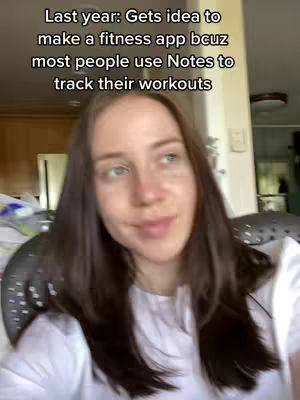 A woman with brown hair and a white shirt is centered in the frame, looking towards the camera with a subtle smile. Above her head, a text overlay reads, about an app idea.