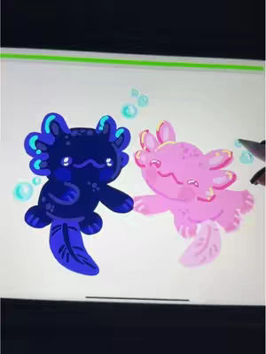 An illustration on a tablet screen features two cartoon axolotls. One is dark blue with blue accents, and the other is pink. They appear playful, with bubbles around them. The background is a simple white.