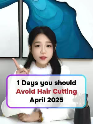 A young woman points upward with her right index finger, centered in the frame. She is wearing a white top, and a bordered text box in the lower-center displays the text '1 Days you should Avoid Hair Cutting April 2025'. The background features abstract artwork and a wall in a home environment.