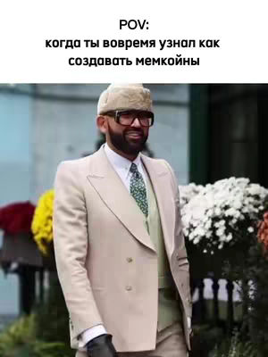 A man in a light-colored suit with glasses and a hat stands outside. Text overlays the image.
