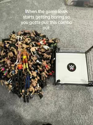 The image shows a collection of wrestling action figures piled together, with a wrestling ring in the background. Text overlays the image, describing the scene and the context.