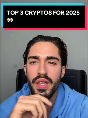 A man with dark hair and a beard is centered in the frame, wearing a blue hoodie. Above him, a black banner displays white text. The background is a plain gray wall.