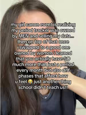 The image is a selfie-style shot of a woman from the chest up, set against a neutral background. The woman has dark, slightly wavy hair. Overlaid on the image is text in a handwritten style. The overall composition is a close-up shot, focusing primarily on the woman's face and the superimposed text.