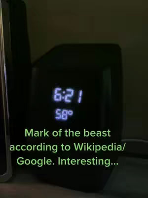 The image shows a dark digital clock displaying the time and temperature set against a dimly lit backdrop. Overlayed on the image is text discussing the concept of the "Mark of the beast" based on Wikipedia and Google.