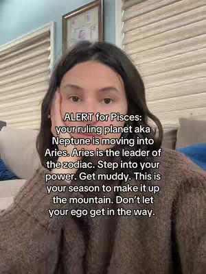 A woman is shown close-up, facing the camera with her hand against her cheek. Text overlays the image, providing astrological insights.