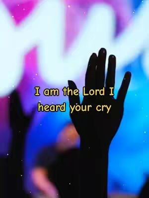 The image presents a silhouetted hand raised towards the sky, with visible fingers and palm against a blurred background of purples, blues, and whites. Overlayed in the center are golden-yellow words on a black background. The overall aesthetic is inspirational, the lighting is a soft glow.