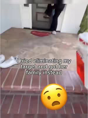 The image shows an outdoor scene with a person standing near a doorway. Text overlayed on the image reads "I tried eliminating my target and got her family instead." There is an emoji of a concerned face near the bottom of the image.