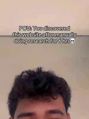 A selfie-style shot from the chest up, showing a person's head and upper chest. The person has dark, wavy hair. The background is a plain, light beige color. The top section of the image contains text overlay in a sans-serif font against a neutral backdrop.
